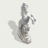 Natural white marble horse sculpture with powerful raised pose, detailed mane, and decorative wave carving on a clean background.