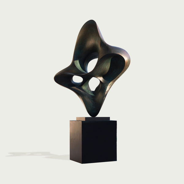 Abstract bronze large woven knot form sculpture against a light gray background