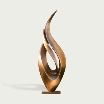 Abstract large dancing flame bronze sculpture on a light gray background