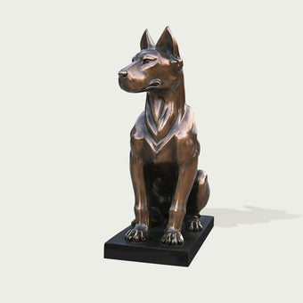 Bronze dog statue  lifelike gaze on a white background