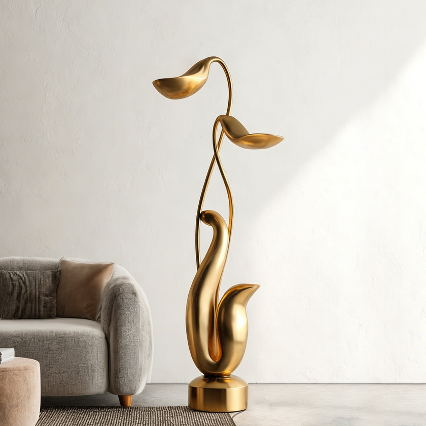  Modern Abstract Gold Floral Sculpture in a living room setting with a sofa and neutral decor.