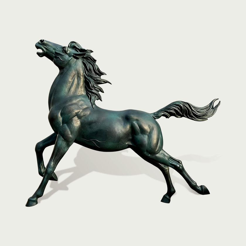 Bronze sculpture of a horse rearing on a light gray background