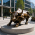 Charging Bronze Bull Statue Large Outdoor Sculpture  in front of a modern building