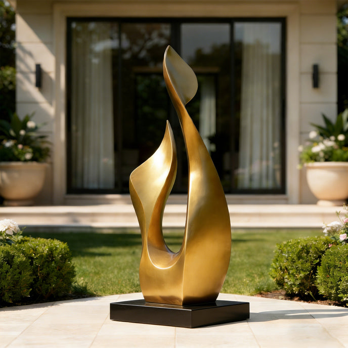 Abstract Botanical Sprout Modern Bronze Sculptures on a patio with a house and garden in the background