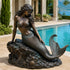 Coastal Fantasy Mermaid Bronze Sculpture by a poolside in a luxury coastal villa.