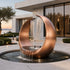 Abstract Contemporary Crescent Bronze Sculpture Water Fountain in front of a courtyard in a luxury villa by coast 
