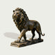 Classic Striding Lion Bronze Animal Sculpture standing on a textured rectangular base, shown against a plain light gray background with a soft shadow.