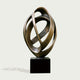 Continuous Interlocking Ribbon Abstract Bronze Sculpture in a bronze finish, mounted on a black rectangular pedestal against a light gray background.