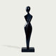 Graceful Female Silhouette Glossy Black Bronze Sculpture standing on a rectangular black base against a light gray background.