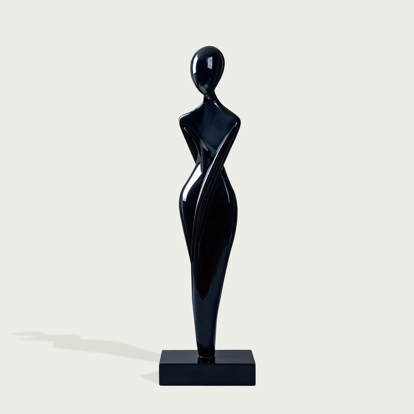Graceful Female Silhouette Glossy Black Bronze Sculpture standing on a rectangular black base against a light gray background.