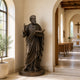 St. Luke The Evangelist Bronze Statue Outdoor Sculpture in the corner of a church