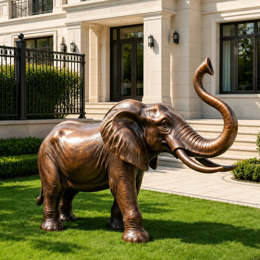 Lucky Raised Trunk Elephant Bronze Sculpture Large Outdoor Statues on a law in front of a luxury villa