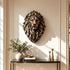 Majestic bronze lion head wall sculpture displayed in an elegant luxury interior, featuring a powerful frontal expression, deeply sculpted flowing mane, and warm antique bronze highlights above a marble console table.