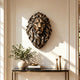 Majestic bronze lion head wall sculpture displayed in an elegant luxury interior, featuring a powerful frontal expression, deeply sculpted flowing mane, and warm antique bronze highlights above a marble console table.
