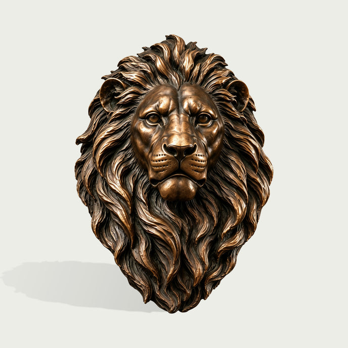 Front view of a detailed bronze lion head wall sculpture with a symmetrical face, intense eyes, realistic facial features, and a richly layered flowing mane enhanced by warm bronze highlights and dark recessed tones.