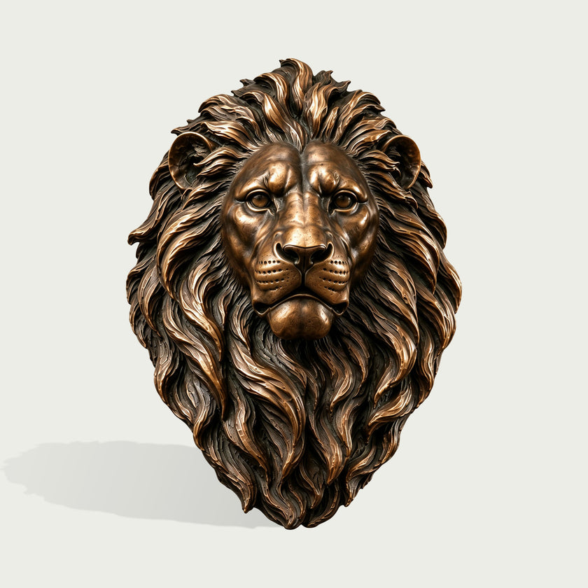 Front view of a detailed bronze lion head wall sculpture with a symmetrical face, intense eyes, realistic facial features, and a richly layered flowing mane enhanced by warm bronze highlights and dark recessed tones.
