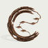 Front view of an abstract bronze crescent sculpture with layered bark-textured arcs, open negative space, slender branching stems, and five stylized leaf forms creating a flowing organic composition.