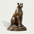 Large sitting bronze panther sculpture with an alert expression, powerful chest and shoulders, finely modeled paws, long curled tail, smooth realistic anatomy, and a rugged natural rock-style bronze base.
