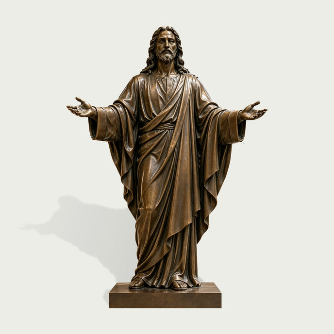 Front view of a life-size bronze Jesus Christ statue with open arms, detailed facial features, long hair, beard, and deeply sculpted flowing robes.