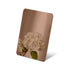 Stainless steel color sample mirror polished brown with a reflection of white flower on a white background