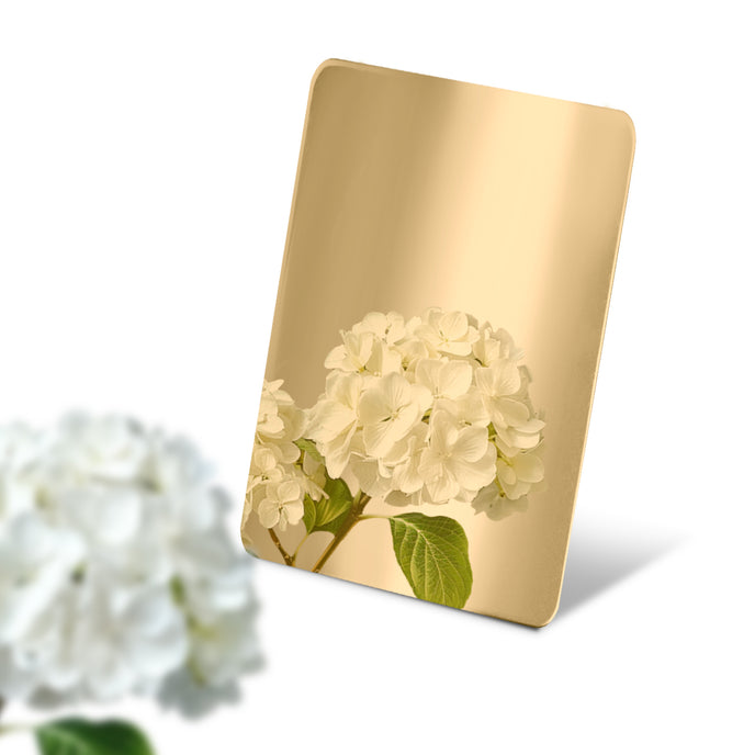 Stainless Steel Color Sample Mirror Polished Gold with a reflection of white color on a white background.