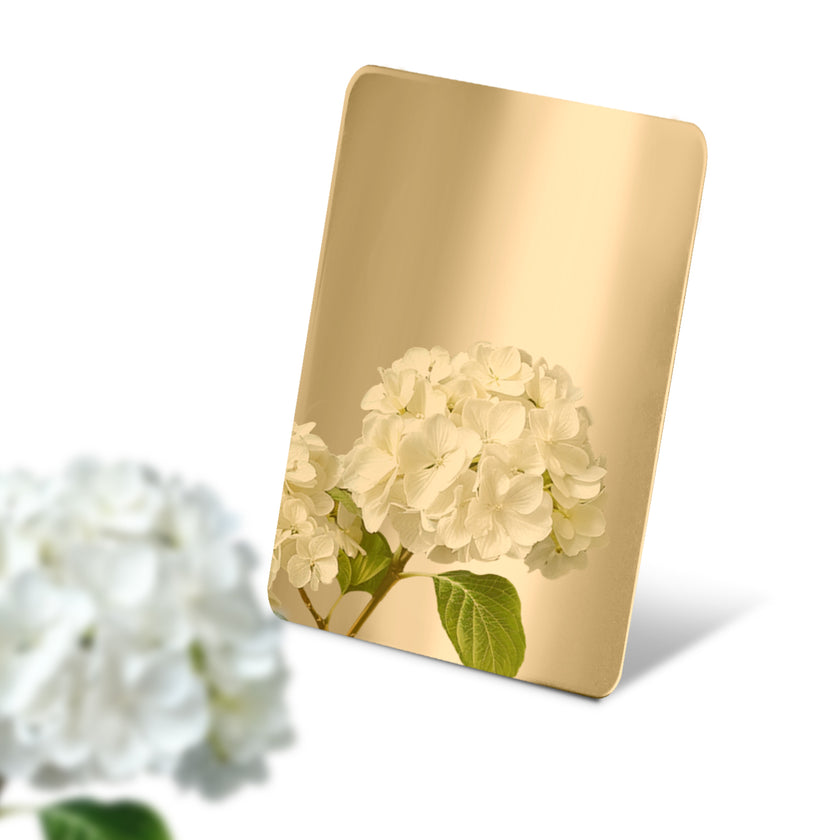 Stainless Steel Color Sample Mirror Polished Gold with a reflection of white color on a white background.