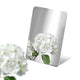 Stainless Steel Color Sample Mirror Polished Silver with a reflection of white flower on a white background.
