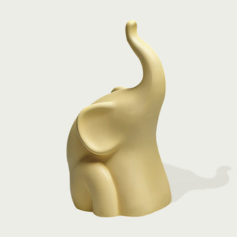 Modern Abstract Elephant Sculpture with Raised Trunk on a light gray background