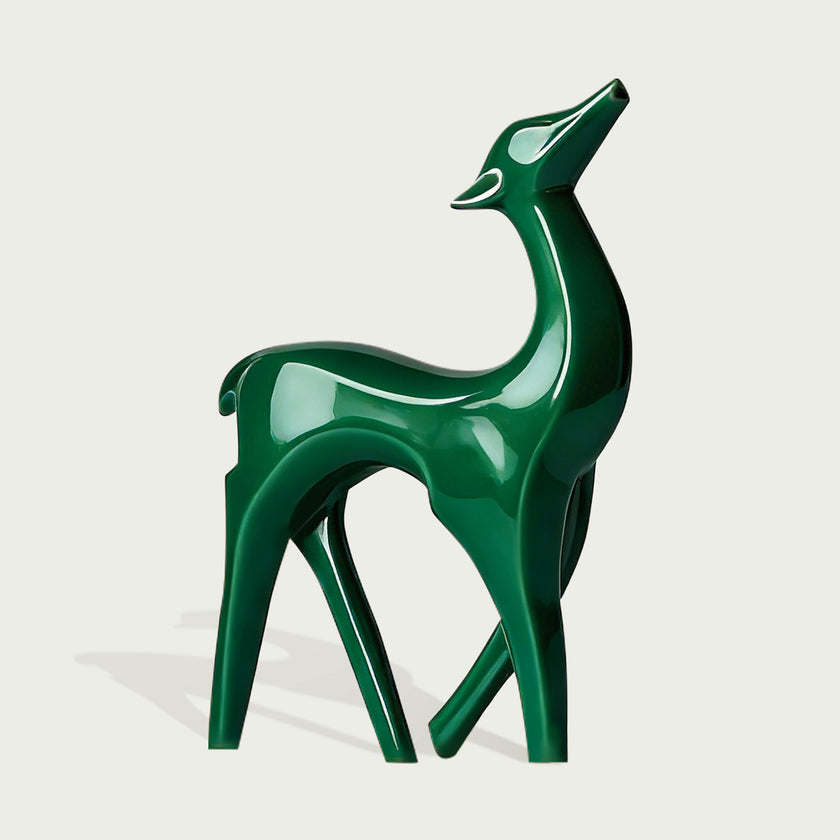 Vibrant Fiberglass Sculpture Christmas Reindeer Pair For Modern Decor. Two decorative deer statues, one red and one green on a light gray background