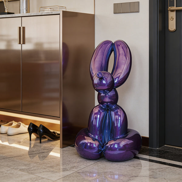 Pop-Art Rabbit Fiberglass Sculpture In Metallic Purple in a modern interior setting