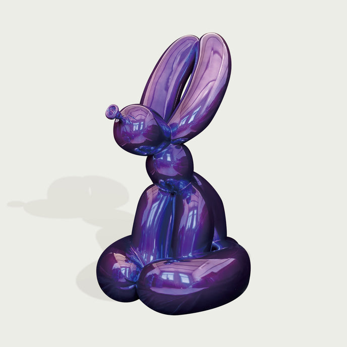 Pop-Art Rabbit Fiberglass Sculpture In Metallic Purple on a light beige background