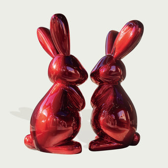 Striking Metallic Red Fiberglass Rabbit Sculpture on a light gray background