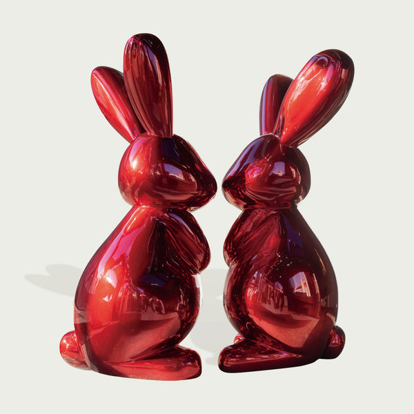 Striking Metallic Red Fiberglass Rabbit Sculpture on a light gray background