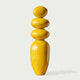 A Modern Glossy Yellow Stacked Pebble Fiberglass Sculpture on a white background