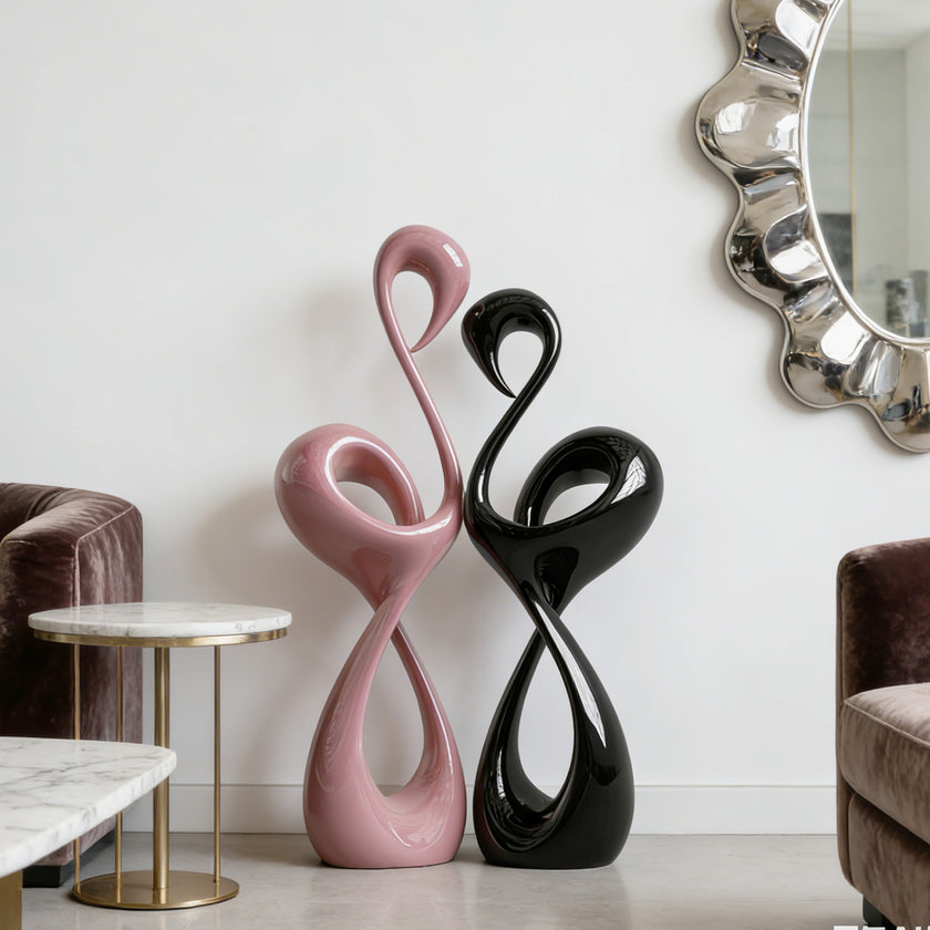 Elegant Pink and Black Flamingo Fiberglass Sculpture in a room with a mirror and furniture.