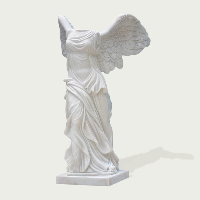 Classic Greek Winged Victory Of Samothrace Marble Statue Replica on a white background
