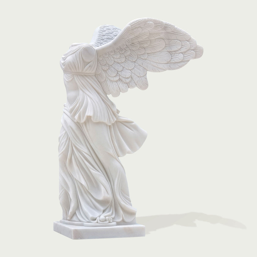 Classic Greek Winged Victory Of Samothrace Marble Statue Replica on a white background