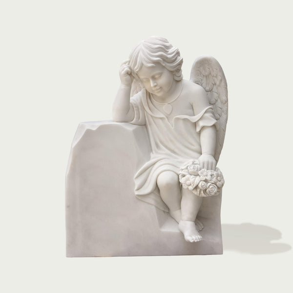 Classic cherub resting angel marble statue for cemetry memorials on a white background