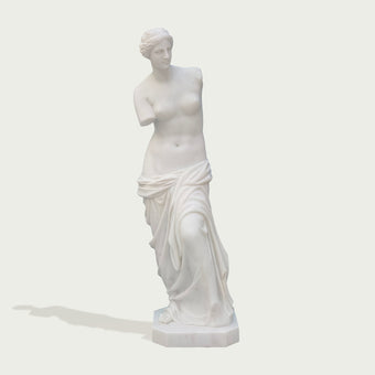 Venus de milo greek goddess sculpture replica on a light gray background