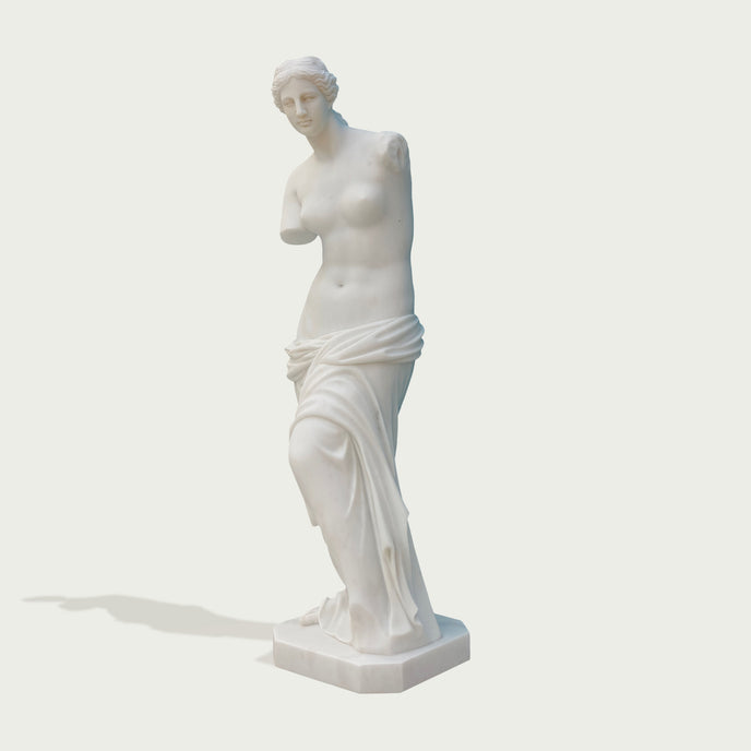 Venus de milo greek goddess sculpture replica on a light gray background