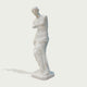 Venus de milo greek goddess sculpture replica on a light gray background