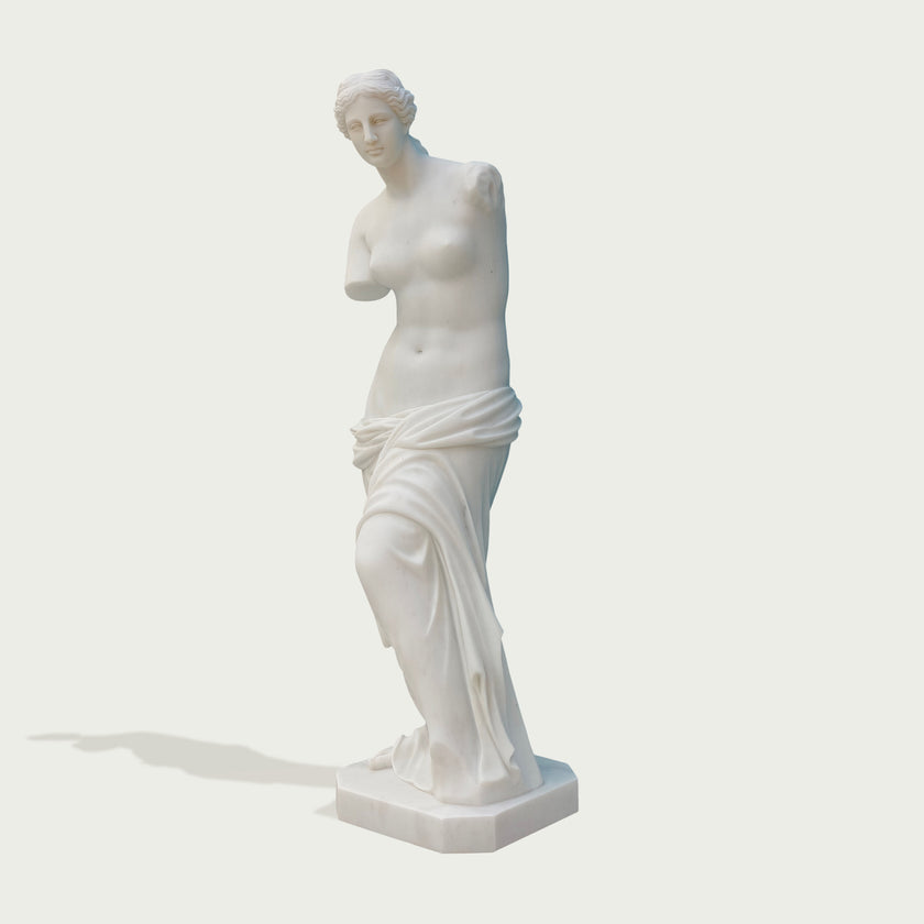 Venus de milo greek goddess sculpture replica on a light gray background