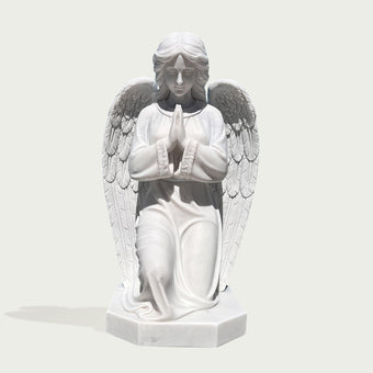 knneling praying angel marble statue on a white background