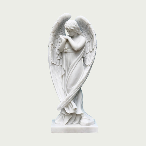Elegant stainding praying marble angel statue on a light gray background