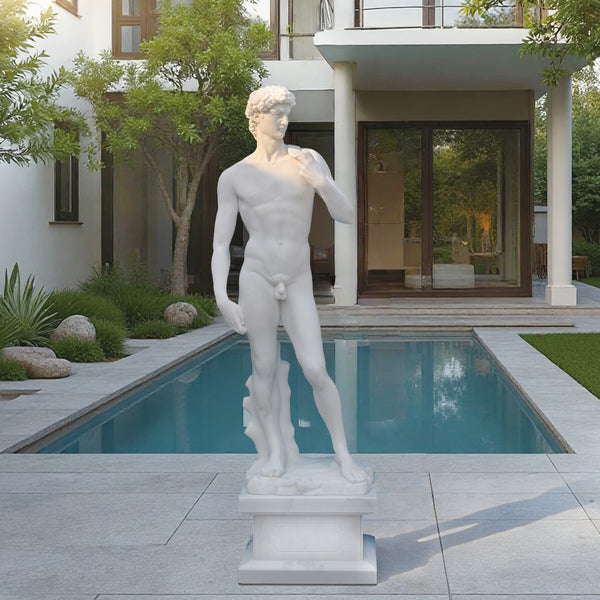 Classic Michelangelo's David Marble Statue Replica in front of a modern house with a pool.