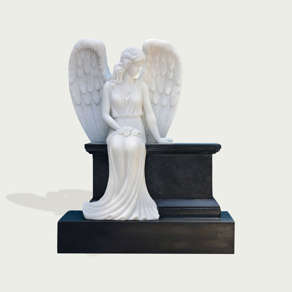 Peaceful Guardian Angel Marble Statue Monument on a pedestal against a light gray background