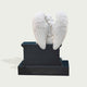 Peaceful Guardian Angel Marble Statue Monument on a pedestal against a light gray background