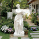 Classic Four Seasons Flora Marble Statue With Flower Basket in a Private Gardens with a lot of flowers and plants
