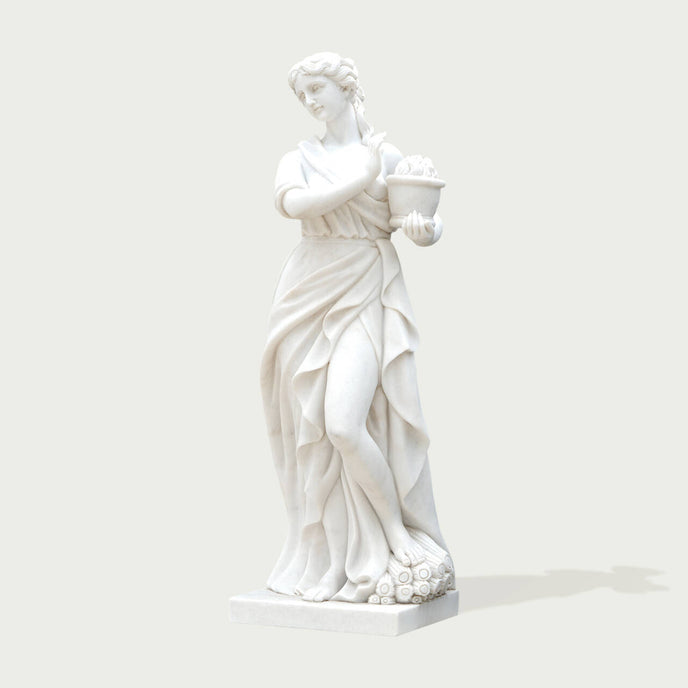 Classic Four Seasons Flora Marble Statue With Flower Basket on a white background.