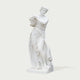 Classic Four Seasons Flora Marble Statue With Flower Basket on a white background.